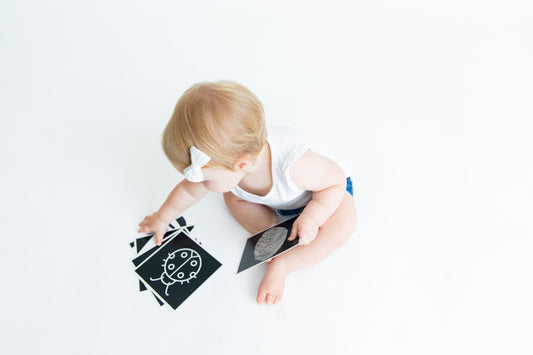 Baby enjoying looking at and fully engaged with our baby high contrast flash cards
