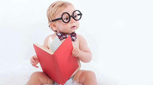 Baby wearing glasses looking into the distance, the question is how far away should a baby be to see high contrast products, shop baby geometrics for high contrast baby products